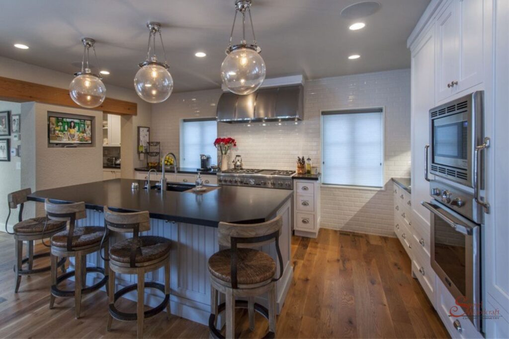 Traditional Kitchen Cabinets with Custom Details by Swirl Woodcraft